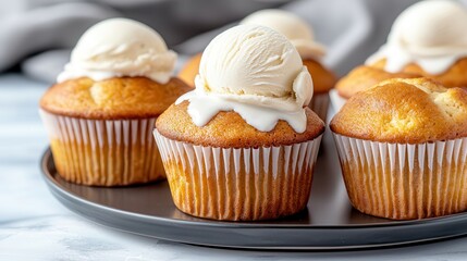 Vanilla baking desert delight. Delicious cupcakes with creamy ice cream toppings on a plate.