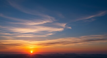 Soft Wispy Cirrus Clouds at Sunrise Over a Deep Blue Sky