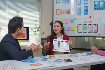 Web designers working on user interface and user experience for mobile application