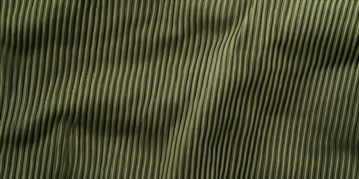 A classic corduroy fabric texture background in deep olive green. The visible parallel ridges, velvety surface, and slightly worn texture evoke a retro, casual, and stylish appeal, perfect for vintage
