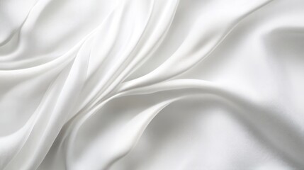 Obraz premium Smooth white silk fabric draped in elegant folds. Possible use Fashion, textile, background