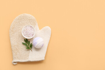 Naklejka na ściany i meble Massage glove, sea salt and bath bomb on color background