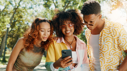 Friends, online and surprised with mobile at park for social media post, gossip news and internet drama. Gen z people, happy and smartphone with dating site, show text notification and reading chat