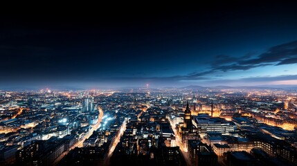 Night cityscape panorama, illuminated streets and buildings