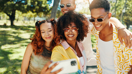 Gen z, happy people and friends in nature for selfie together for cool fashion, bonding or reunion. Hangout, social media influencer or men with women in outdoor park for picture, vacation or holiday