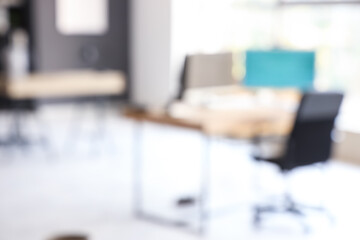 Blurred view of modern office with computers
