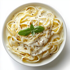 A plate of spaghetti carbonara, topped with basil and pepper on white background. 