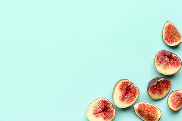 Cut fresh figs on turquoise background