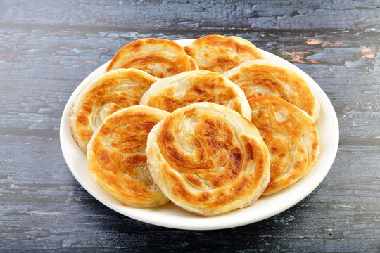 golden colour crispy fried parathas, Indian breads. 