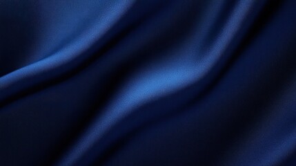 Fototapeta premium A close-up of elegant, flowing blue fabric, showcasing its smooth texture and rich color, conveying a sense of luxury and sophistication.