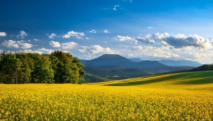vibrant landscape with yellow fields mountains trees and blue sky capturing the beauty of nature