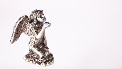 Figurine of an angel on white background