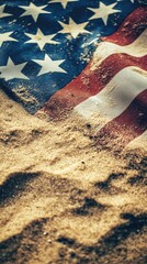 A lone American flag lying on a sandy beach