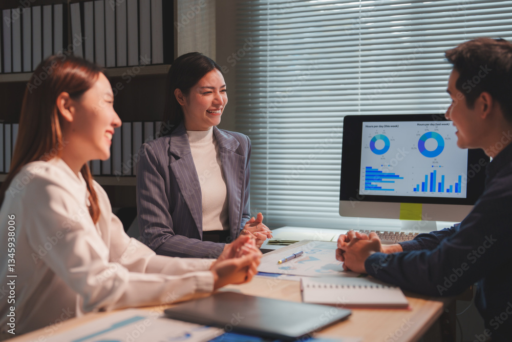 Poster three happy asian business colleagues discussing financial report using desktop computer during a pr