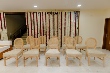 Luxurious indian wedding decoration entrance decorated with lighting and flowers,