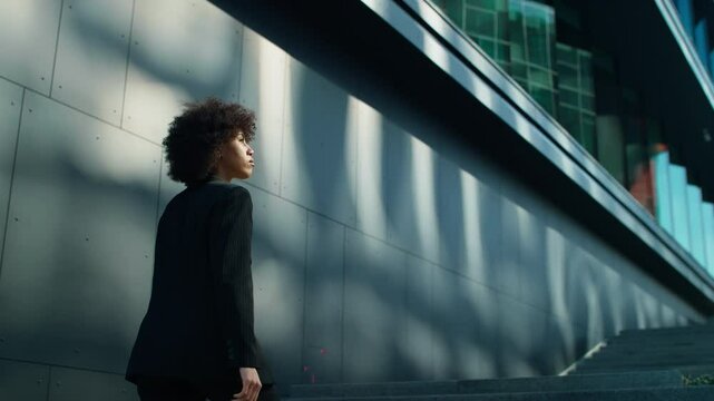 Businesswoman walking to work in modern city