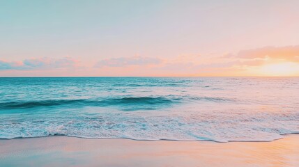 Obraz premium A serene beach scene at sunset, showcasing gentle waves and a tranquil sky with soft hues of blue and pink, inviting relaxation and reflection.