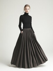 Fototapeta premium A woman wearing a black turtle neck top and long skirt, great for use as a model or fashion reference