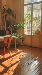 Fototapeta premium Sunlit home office with plants, laptop, wooden chair and floor. Parisian apartment view.