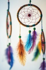 A collection of brightly colored feathers attached to a string, ideal for decorating or using in creative projects