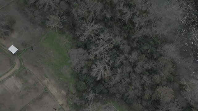 Top down view of creek meandering through amelie les bains, france