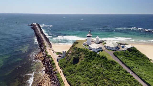 Flyover Nobbys lighthouse at entrance to Newcastle NSW harbour, AUS