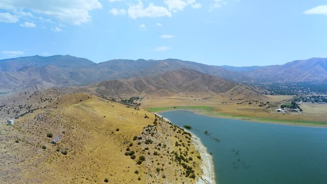 Lake Isabella, Sierra Nevada, Kern County, California - A Lake Nestled in a Valley, Surrounded by Golden Hills and Rugged Mountains - Aerial Drone Shot