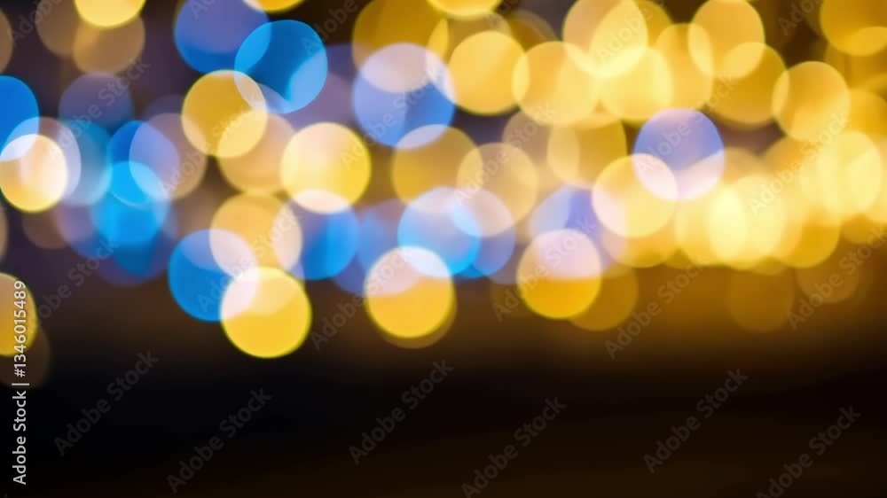 Poster blurred yellow and blue bokeh lights creating a festive and abstract background effect at night time