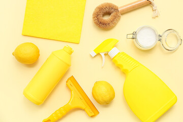Composition with natural cleaning supplies and brushes on color background