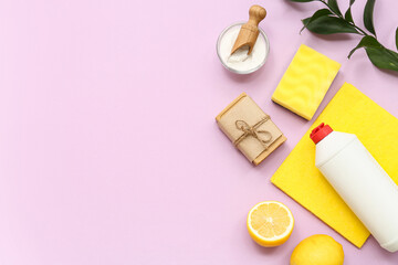 Composition with different natural cleaning supplies on lilac background