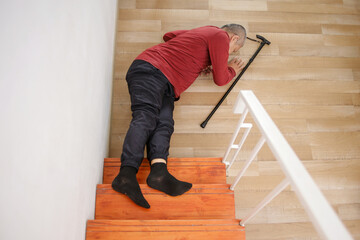 Senior Man Faints And Collapses On The Stairs Of The House