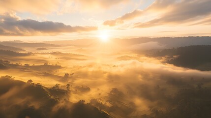 Fototapeta premium Golden Sunrise over Misty Mountain Landscape Aerial View