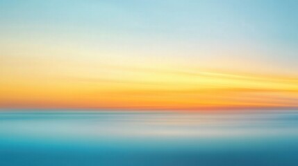 Abstract blurred smooth color blend shifting from soft blue to vibrant golden yellow sunset seascape motion blur effect