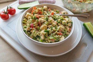 Bulgur salad with feta cheese, cucumber, tomatoes, parsley  
