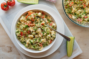 Bulgur salad with feta cheese, cucumber, tomatoes, parsley  