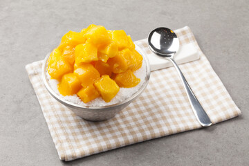 Patbingsu is a food made by crushing ice into small pieces and adding boiled red beans or sugar.