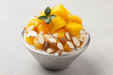 Patbingsu is a food made by crushing ice into small pieces and adding boiled red beans or sugar.