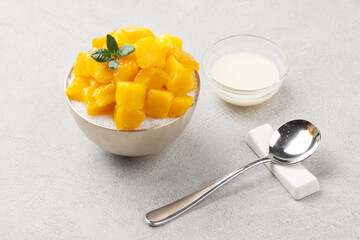 Patbingsu is a food made by crushing ice into small pieces and adding boiled red beans or sugar.
