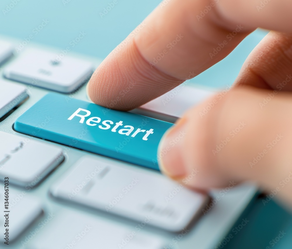 Poster finger pressing restart button on a teal keyboard close up shot of technology restarting