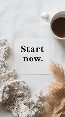 Naklejka premium Delicate off-white paper features a motivational phrase, surrounded by soft natural elements and a steaming cup of coffee, inviting positivity and action in an inviting atmosphere