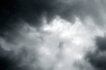 Dramatic stormy sky background. Dark fluffy cloudy sky. Moody spooky cloudscape. Rainy season.