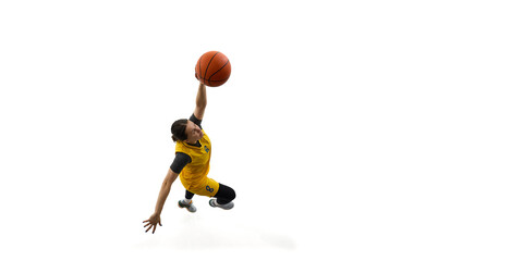 Top view dynamic image of woman, basketball player scoring goal, throwing ball in basket isolated on white background. Slam dunk. Concept of sport, competition, game, action, active lifestyle. Ads