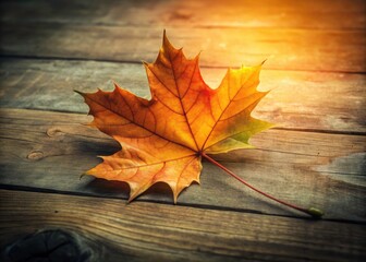 Obraz premium Minimalist Maple Leaf on Wooden Table - Autumn Wallpaper Photography