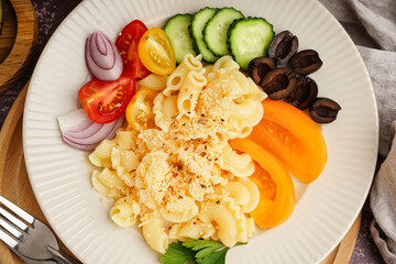 Plate with delicious Italian pasta salad on table
