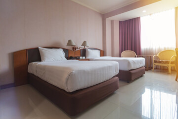 Double bed in the modern interior room. Modern interior hotel room with furniture double bed. Contemporary bedroom with open big window.
