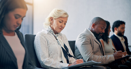 Business, writing and audience in seminar, group and colleagues in workshop for training or meeting. Conference, information and coworkers with notes for presentation, listen and people in boardroom