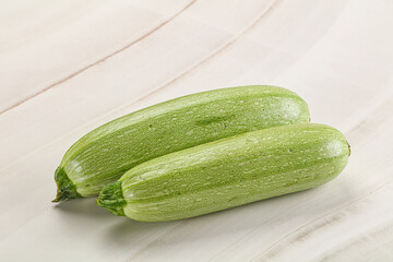 Raw green ripe zucchini vegetable