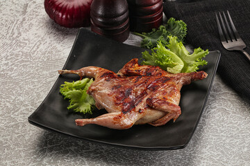 Grilled quail in the plate