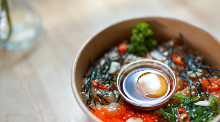 A delicious and nutritious salmon sushi bowl with fresh ingredients, served as a healthy alternative to traditional rice. 
