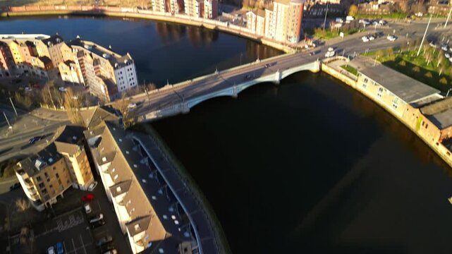 Overhead aerial of Queen's Bridge and the River Lagan in Belfast on a bright, sunny day. Filmed in 4K, 30FPS and in Rec709 color.